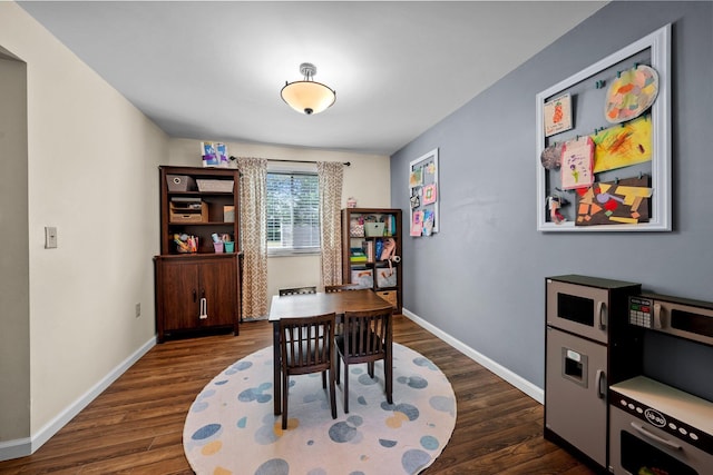 office space with dark wood-style floors and baseboards