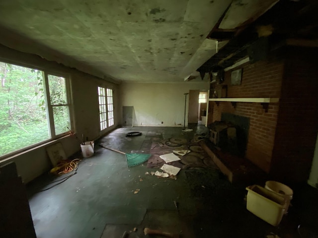 2615 Hamburg Rd SW, Lancaster, OH 43130 - unfurnished living room featuring a brick fireplace