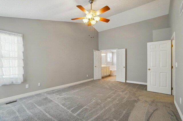 317 Audubon St, Pickerington, OH 43147 - unfurnished bedroom featuring high vaulted ceiling, carpet, baseboards, ensuite bathroom, and ceiling fan