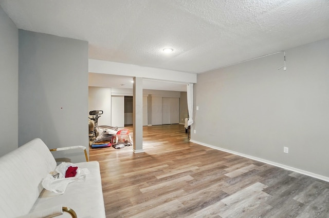 317 Audubon St, Pickerington, OH 43147 - sitting room with wood finished floors, a textured ceiling, and baseboards