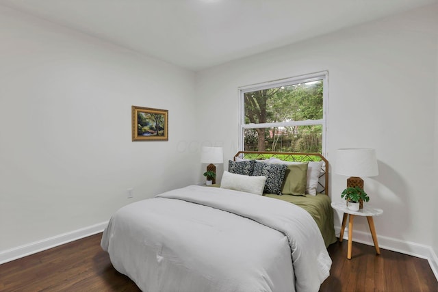 234 Rosslyn Ave, Columbus, OH 43214 - bedroom with baseboards and wood finished floors