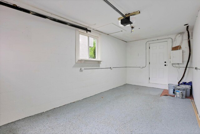 234 Rosslyn Ave, Columbus, OH 43214 - garage featuring a garage door opener and electric panel