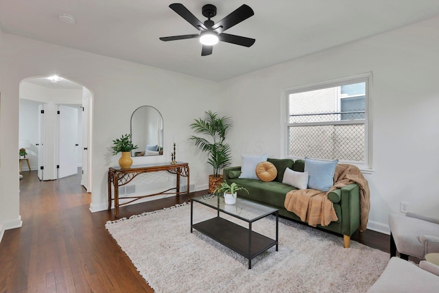 234 Rosslyn Ave, Columbus, OH 43214 - living area with arched walkways, a ceiling fan, wood finished floors, and baseboards
