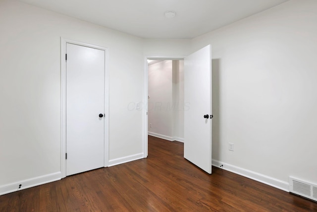 234 Rosslyn Ave, Columbus, OH 43214 - unfurnished bedroom featuring wood finished floors and baseboards