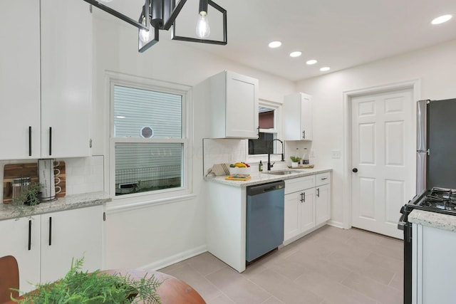 234 Rosslyn Ave, Columbus, OH 43214 - kitchen with dishwashing machine, a sink, freestanding refrigerator, black gas range oven, and decorative backsplash