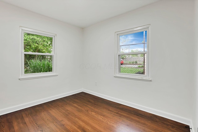 234 Rosslyn Ave, Columbus, OH 43214 - spare room featuring baseboards and dark wood-style floors