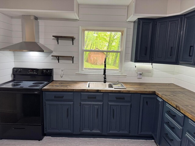 9966 Larimer Rd, Logan, OH 43138 - kitchen with electric range, wall chimney exhaust hood, a sink, and blue cabinetry