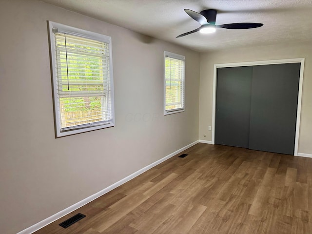 9966 Larimer Rd, Logan, OH 43138 - unfurnished bedroom featuring wood finished floors, baseboards, and multiple windows