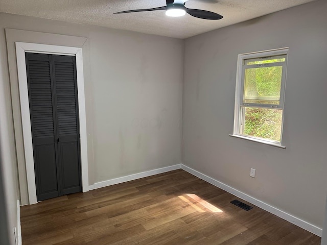 9966 Larimer Rd, Logan, OH 43138 - unfurnished bedroom featuring wood finished floors, baseboards, a textured ceiling, and a ceiling fan