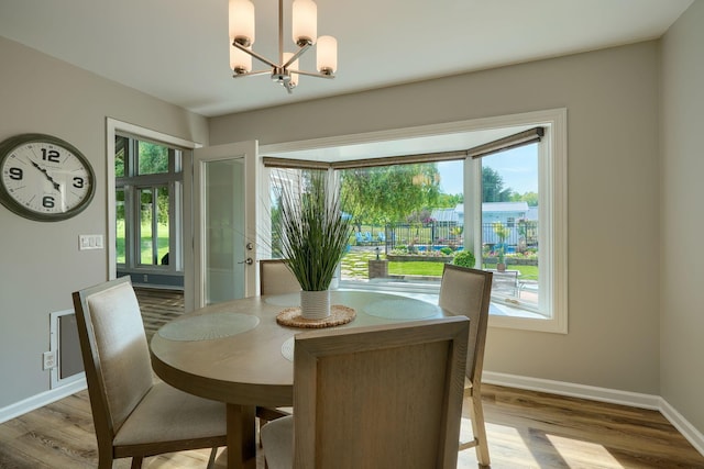1899 Lamb Rd NW, Carroll, OH 43112 - dining space featuring a chandelier, light wood-style floors, and baseboards