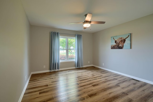 1899 Lamb Rd NW, Carroll, OH 43112 - spare room featuring a ceiling fan, wood finished floors, and baseboards