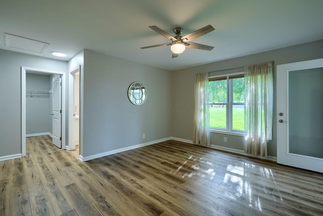1899 Lamb Rd NW, Carroll, OH 43112 - empty room featuring ceiling fan, wood finished floors, baseboards, and attic access