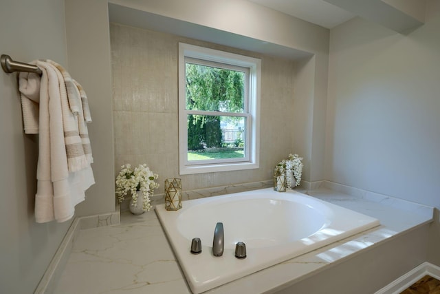 1899 Lamb Rd NW, Carroll, OH 43112 - full bath with a garden tub, marble finish flooring, and baseboards