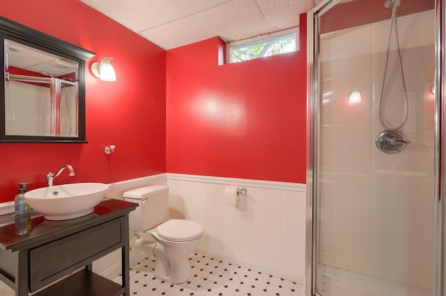 1899 Lamb Rd NW, Carroll, OH 43112 - bathroom with a shower stall, a wainscoted wall, a drop ceiling, toilet, and vanity