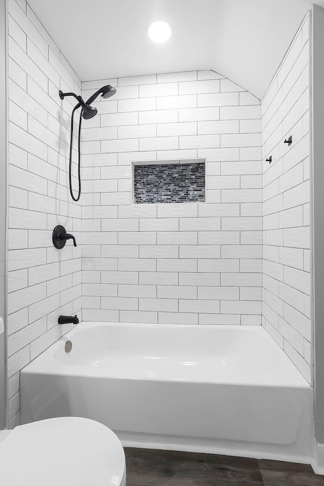 527 E Welch Ave, Columbus, OH 43207 - full bathroom featuring wood finished floors, toilet, and shower / tub combination