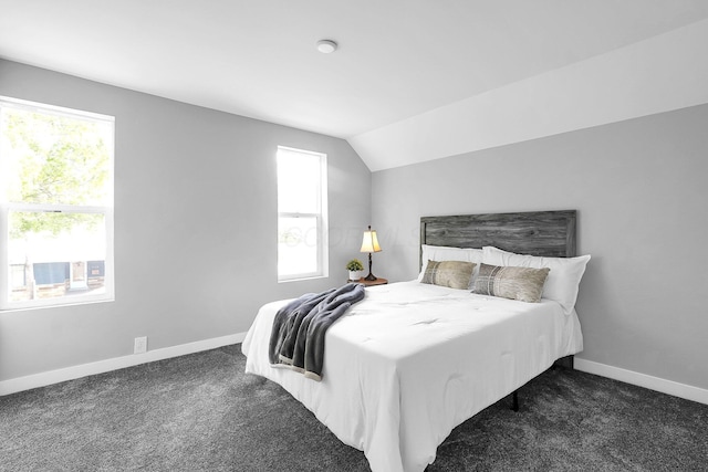 527 E Welch Ave, Columbus, OH 43207 - bedroom featuring dark colored carpet, baseboards, and lofted ceiling
