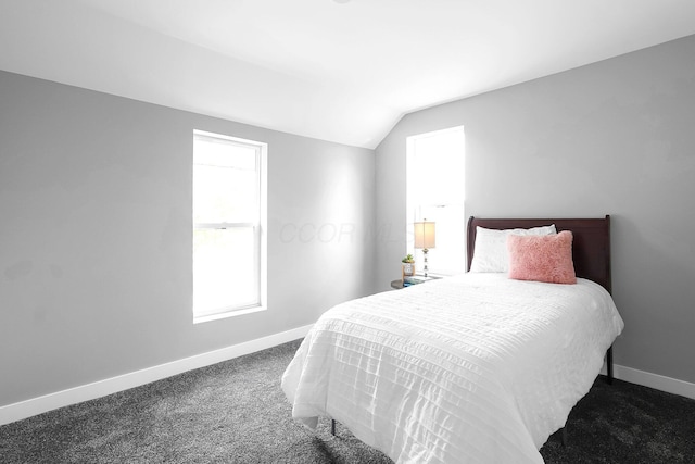 527 E Welch Ave, Columbus, OH 43207 - carpeted bedroom featuring vaulted ceiling and baseboards