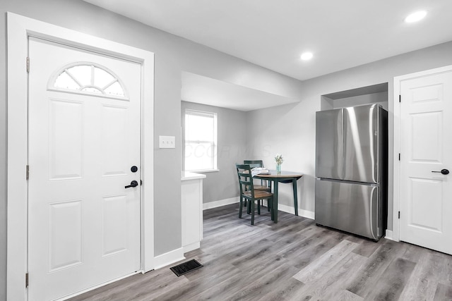 527 E Welch Ave, Columbus, OH 43207 - foyer entrance with light wood-style floors, baseboards, and recessed lighting