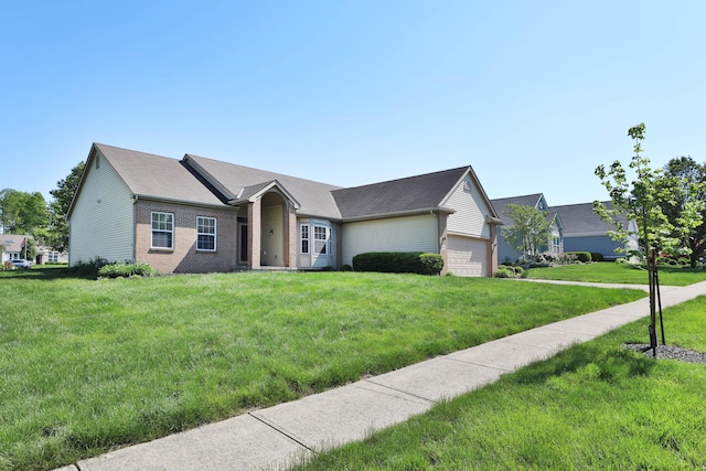 5988 Carnegie Cove Ct, Columbus, OH 43213 - ranch-style house featuring brick siding, a garage, and a front lawn