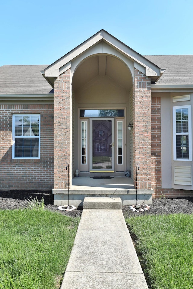 5988 Carnegie Cove Ct, Columbus, OH 43213 - property entrance with brick siding and a shingled roof
