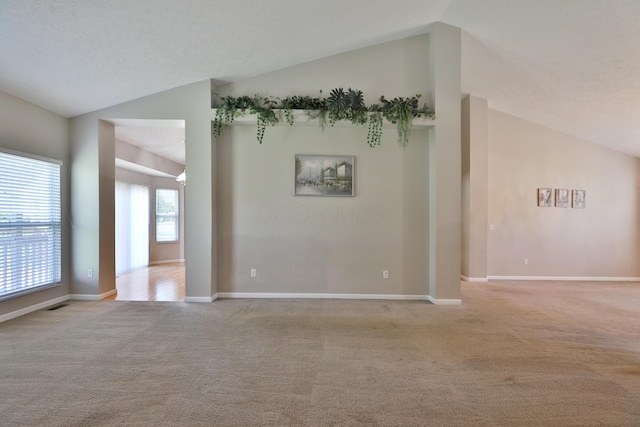 5988 Carnegie Cove Ct, Columbus, OH 43213 - carpeted spare room featuring vaulted ceiling and baseboards