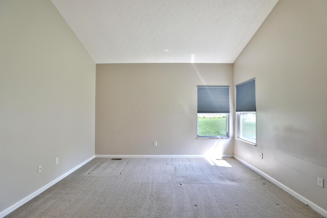 5988 Carnegie Cove Ct, Columbus, OH 43213 - unfurnished room featuring lofted ceiling, carpet floors, and baseboards