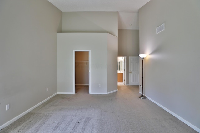 5988 Carnegie Cove Ct, Columbus, OH 43213 - carpeted empty room featuring a towering ceiling and baseboards