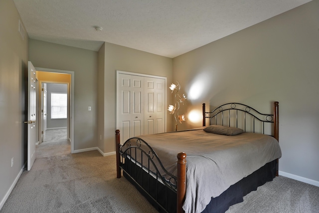 5988 Carnegie Cove Ct, Columbus, OH 43213 - bedroom featuring carpet floors, a closet, and baseboards