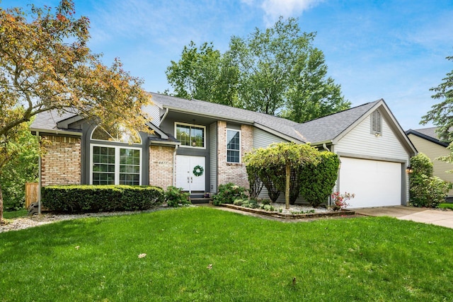 view of front facade with brick siding, a garage, and a front lawn