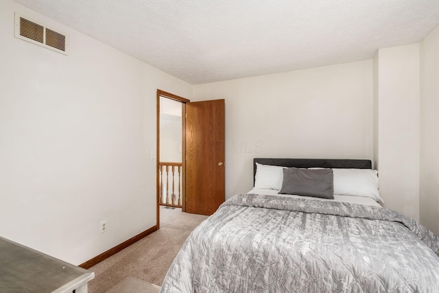 bedroom featuring carpet flooring and baseboards