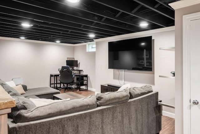 living area with wood finished floors and baseboards