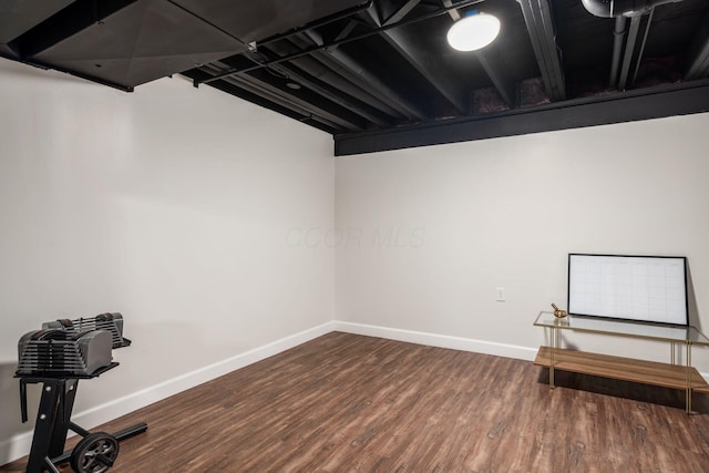 finished below grade area with wood finished floors and baseboards