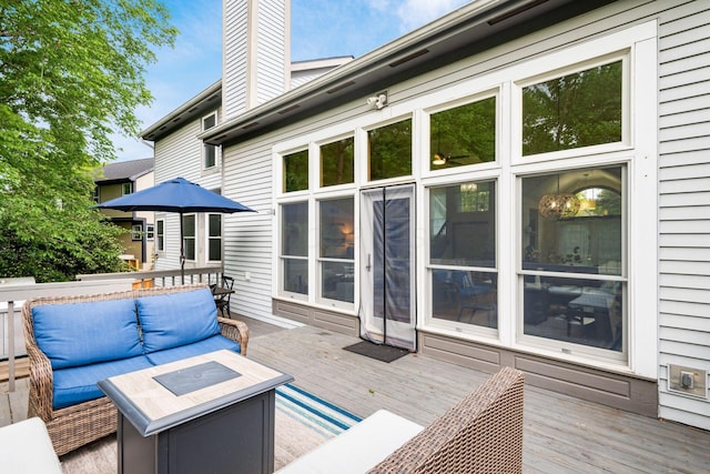 wooden deck featuring outdoor lounge area