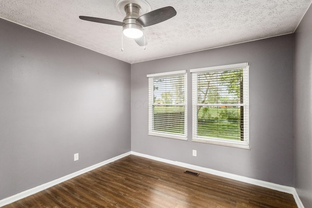 1279 Reana Dr, Galloway, OH 43119 - unfurnished room with wood finished floors, baseboards, a ceiling fan, and a textured ceiling