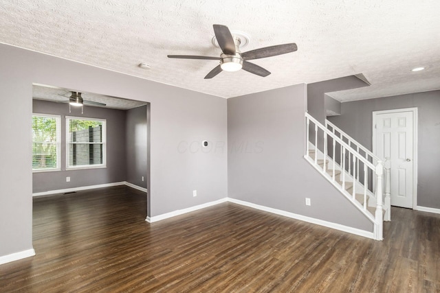 1279 Reana Dr, Galloway, OH 43119 - spare room with ceiling fan, stairway, wood finished floors, and a textured ceiling