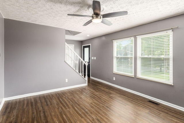 1279 Reana Dr, Galloway, OH 43119 - spare room with stairs, baseboards, ceiling fan, wood finished floors, and a textured ceiling