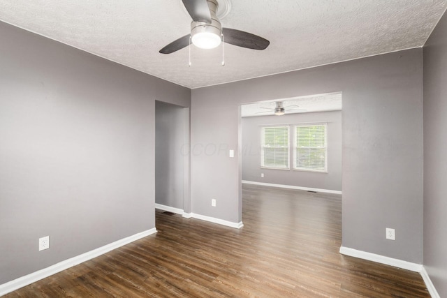 1279 Reana Dr, Galloway, OH 43119 - unfurnished room with a textured ceiling, a ceiling fan, baseboards, and dark wood finished floors
