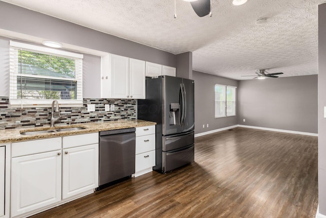 1279 Reana Dr, Galloway, OH 43119 - kitchen with appliances with stainless steel finishes, a ceiling fan, a sink, dark wood-type flooring, and a textured ceiling