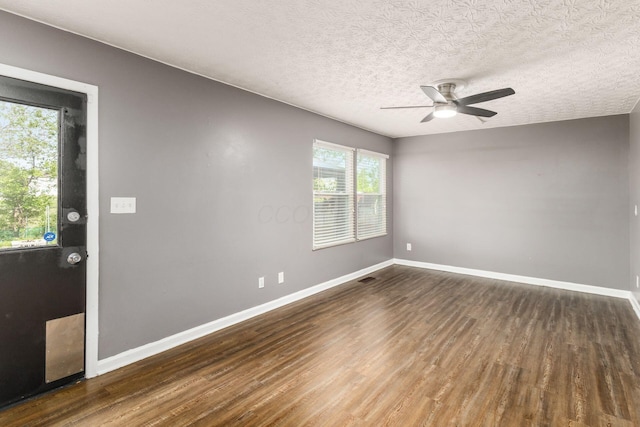 1279 Reana Dr, Galloway, OH 43119 - spare room featuring wood finished floors, a ceiling fan, baseboards, and a textured ceiling