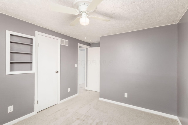 1279 Reana Dr, Galloway, OH 43119 - unfurnished bedroom with baseboards, a textured ceiling, carpet floors, and a ceiling fan