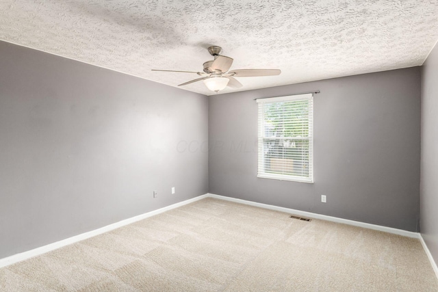 1279 Reana Dr, Galloway, OH 43119 - carpeted empty room with a ceiling fan, baseboards, and a textured ceiling