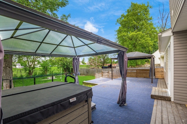 1279 Reana Dr, Galloway, OH 43119 - wooden terrace featuring a gazebo, a hot tub, a fenced backyard, and a patio area