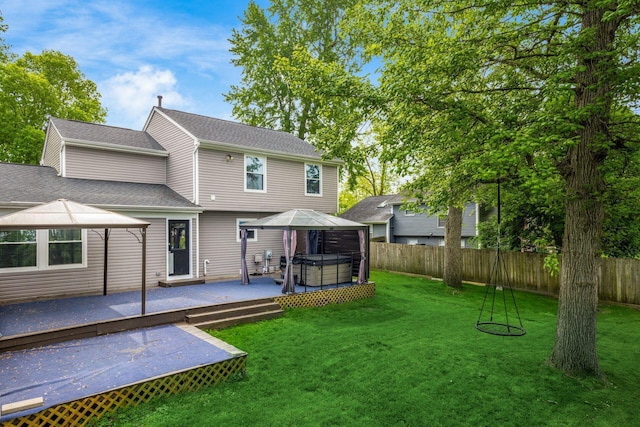 1279 Reana Dr, Galloway, OH 43119 - rear view of property with a hot tub, a gazebo, and a deck