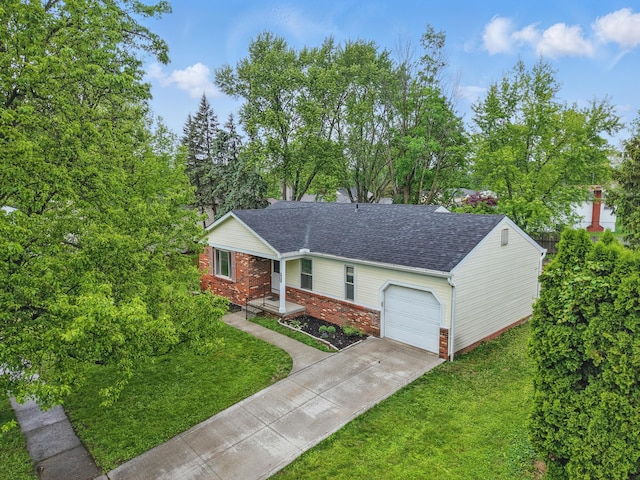 4726 Wendler Blvd, Columbus, OH 43230 - view of front facade with an attached garage, a front lawn, concrete driveway, a shingled roof, and view of scattered trees