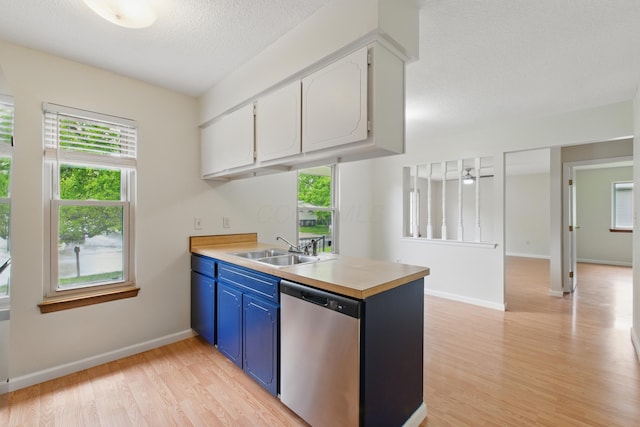 4726 Wendler Blvd, Columbus, OH 43230 - kitchen featuring dishwasher, a sink, blue cabinets, light wood-style flooring, and a peninsula