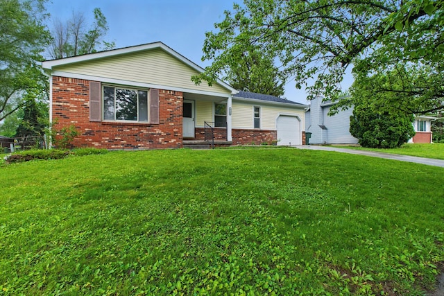 4726 Wendler Blvd, Columbus, OH 43230 - view of front facade featuring an attached garage, a porch, brick siding, concrete driveway, and a front yard