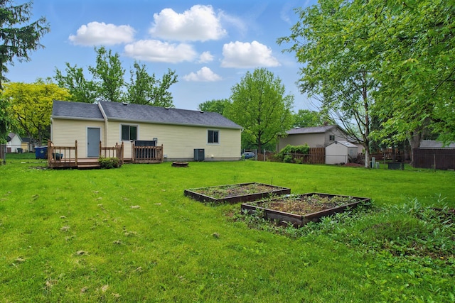 4726 Wendler Blvd, Columbus, OH 43230 - rear view of house with a garden and a deck