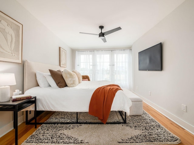 201 E 5th Ave, Columbus, OH 43201 - bedroom with wood finished floors, baseboards, and ceiling fan