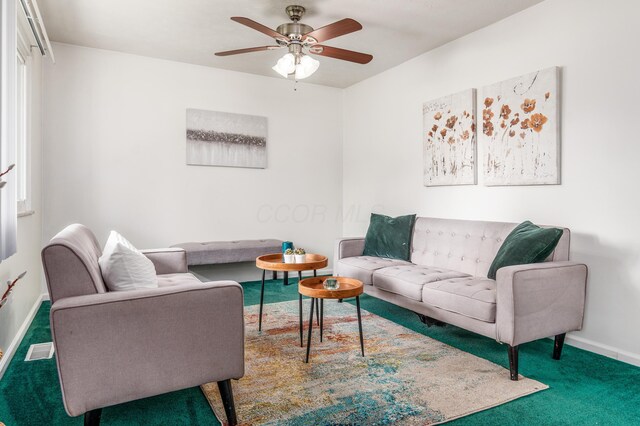717 Birmingham Rd, Westerville, OH 43081 - carpeted living room with baseboards and ceiling fan