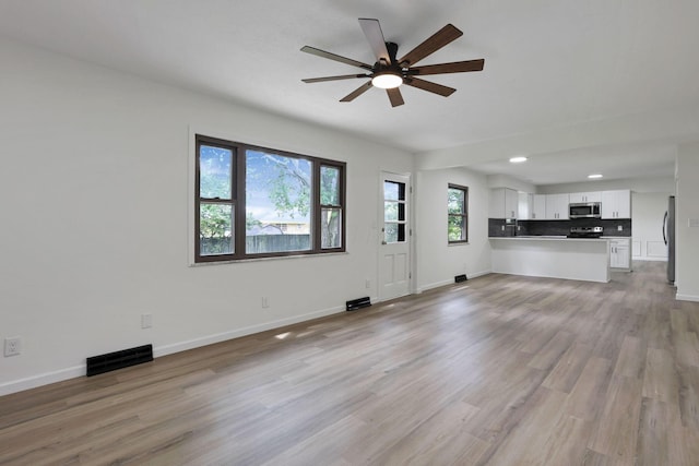 1883 Fairhaven Rd, Columbus, OH 43229 - unfurnished living room with a ceiling fan, light wood-type flooring, baseboards, and recessed lighting